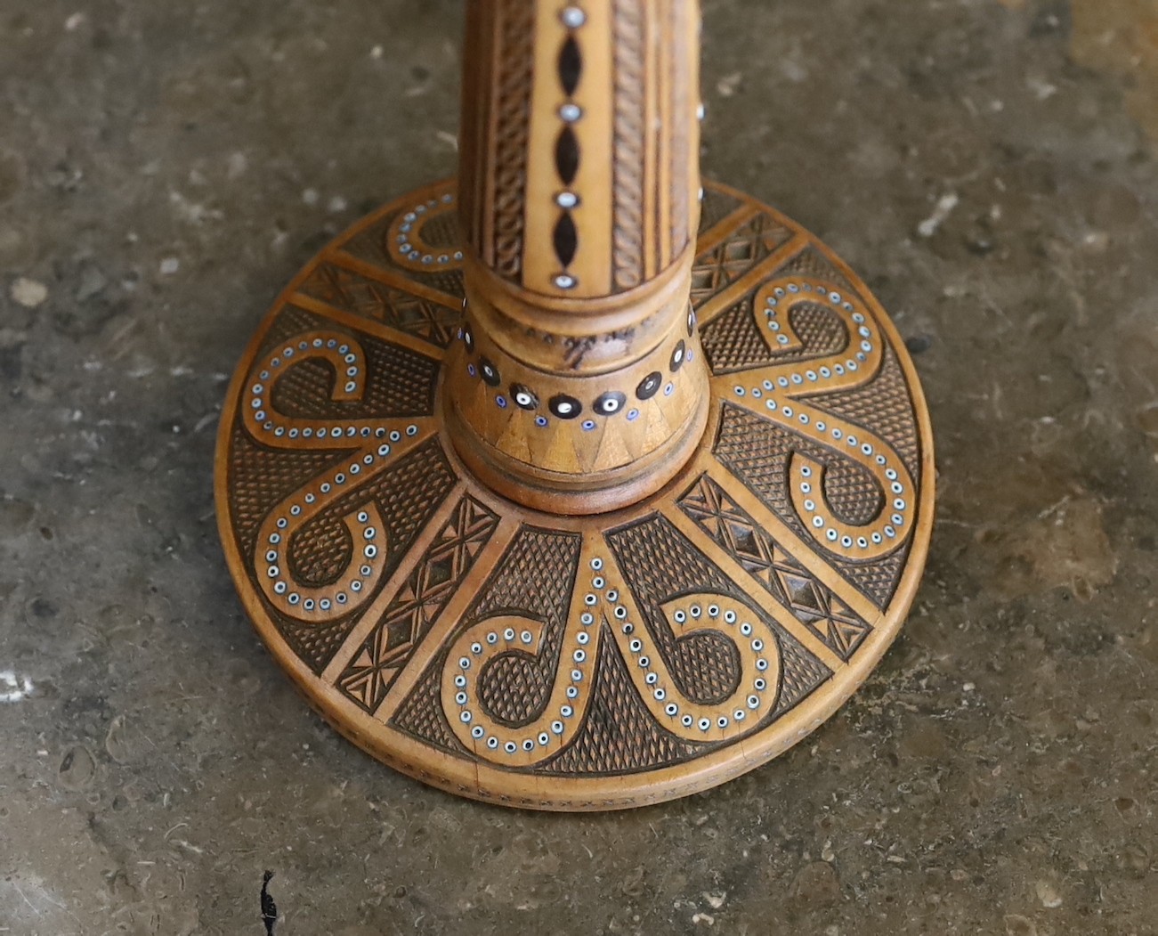 An early 20th century Danish carved and glass bead inset wood lamp base with brass flowerhead mount and associated tinted and frosted glass shade, height to top of shade 47cm
